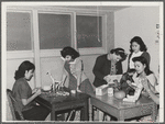 NYA (National Youth Administration) girls who live at the resident center at the FSA (Farm Security Administration) farm workers' community at Eleven Mile Corner, Arizona, learn to use waste materials for toys, jewelry, etc