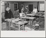 Agricultural workers in the workshop at the FSA (Farm Security Administration) farm workers' community at Eleven Mile Corner, Arizona