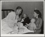 Visitors' hour at the Cairns Hospital at the FSA (Farm Security Administration) farm workers' community. Eleven Mile Corner, Arizona