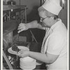 Dishing up vegetables at lunchtime at the Cairns General Hospital at the FSA (Farm Security Administration) farm workers' community. Eleven Mile Corner, Arizona