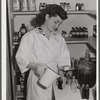 Eleven Mile Corner, Arizona. Cairns General Hospital, FSA farm workers' community. NYA (National Youth Administration) girl bottling medicine. The NYA girls, who live at the resident center, receive training as nurses helpers