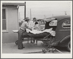 A suburban-type truck has been converted into an ambulance for use at the Cairns General Hospital at the FSA (Farm Security Administration) farm workers' community. Eleven Mile Corner, Arizona
