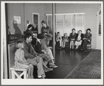 Waiting in the clinic of the Cairns General Hospital at the FSA (Farm Security Administration) farm workers' community. Eleven Mile Corner, Arizona