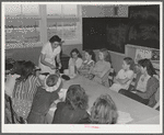 Eleven Mile Corner, Arizona. FSA (Farm Security Administration) farm workers' community. Home economics teacher demonstrating to schoolgirls the proper methods of preparing various foods