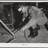 Pinal County, Arizona. Defense training project, U.S. Department of Education. Ranch boys learning welding. This man came to Arizona from Texas, learned welding, and is now working, but comes back to school at night to learn more about the subject