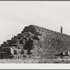 Coolidge, Pinal County, Arizona. Casa Grande Farms, FSA (Farm Security Administration) project. Baled hay