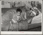 Mexican father and child. San Antonio, Texas. This family was living on relief. The father was obviously very sick. He said he had kidney trouble. He was having no medical attention