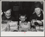 Woodville, California. FSA (Farm Security Administration) farm workers' community. Little boys eyeing cakes in the cooperative store