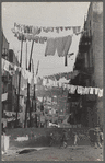An avenue of clothes washings between 138th and 139th Street apartments, just east of St. Anne's Avenue, Bronx, New York
