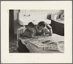 Children reading Sunday papers, Rustan brothers' farm near Dickens, Iowa. Note convenience of running water in background. This farm was formerly owner operated but they are now tenants of Metropolitan Life