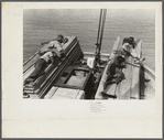 Negro stevedores sleeping on pile of lumber on bow of packet boat on Mississippi River below New Orleans, "El Rito"