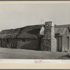 Mexican house. Crystal City, Texas. This house is adobe with palmetto straw roof