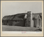 Mexican house. Crystal City, Texas. This house is adobe with palmetto straw roof