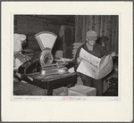 Farmer reading newspaper in feed and general produce store. Eufaula, Oklahoma