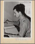 Tulare County, California. FSA (Farm Security Administration) farm workers' camp. Secretary-treasurer of the cooperative store