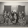 Lisan Kay, Litia Namoura, and Yeichi Nimura (back row, center) and Ruth St. Denis (seated, center) pose with dancers from St. Denis's David ballet at the Ballet Arts Center for Dance in New York City