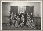 Lisan Kay, Litia Namoura, and Yeichi Nimura (back row, center) and Ruth St. Denis (seated, center) pose with dancers from St. Denis's David ballet at the Ballet Arts Center for Dance in New York City