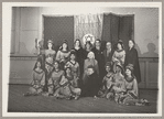 Lisan Kay, Litia Namoura, and Yeichi Nimura (back row, center) and Ruth St. Denis (seated, center) pose with dancers from St. Denis's David ballet at the Ballet Arts Center for Dance in New York City