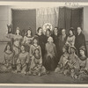 Lisan Kay, Litia Namoura, and Yeichi Nimura (back row, center) and Ruth St. Denis (seated, center) pose with dancers from St. Denis's David ballet at the Ballet Arts Center for Dance in New York City