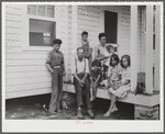 John Bunyan Locklear and family on porch of new home. Pembroke Farms, North Carolina