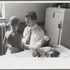 Doctor examining child at preschool clinic. Greenbelt, Maryland