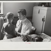 Doctor examining child at preschool clinic. Greenbelt, Maryland