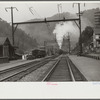 Coal train going through center of mining town. Davey, West Virginia