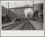 Coal train going through center of mining town. Davey, West Virginia