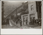 Miners turning in lamps and starting home. Capels, West Virginia