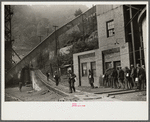 Miners turning in lamps and starting home. Capels, West Virginia