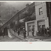 Miners turning in lamps and starting home. Capels, West Virginia