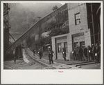 Miners turning in lamps and starting home. Capels, West Virginia