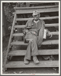 Coal miner waiting for lift home. Capels, West Virginia