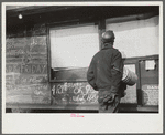 Miner looking at daily reports (company work sheets) checking number of tons of slate he loaded during shift. Also to find out whether or not they work the next day. Capels, West Virginia