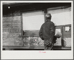 Miner looking at daily reports (company work sheets) checking number of tons of slate he loaded during shift. Also to find out whether or not they work the next day. Capels, West Virginia