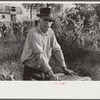 Man living in shack by river, Charleston, West Virginia