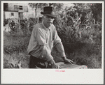 Man living in shack by river, Charleston, West Virginia