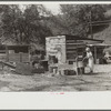 WPA (Works Progress Administration) worker's wife washing clothes in front yard. South Charleston, West Virginia