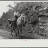 Coal miner's wife bringing groceries from company store, Caples, West Virginia