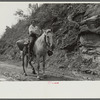 Coal miner's wife bringing groceries from company store, Caples, West Virginia