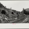 Old abandoned coke ovens with mine tipple in background, Maitland, West Virginia