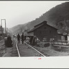 Coal miners returning to and from work and children going from school along tracks, Omar, West Virginia