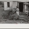Coal miner's wife carrying water from up the hill, Bertha Hill, West Virginia