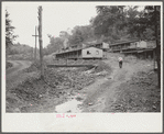 Coal miners' homes, company houses, with piles of slag and slate. "The Patch," Cassville, West Virginia