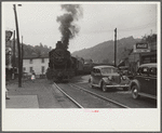 Train pulling coal through center of town morning and evening, Osage, West Virginia