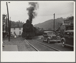 Train pulling coal through center of town morning and evening, Osage, West Virginia
