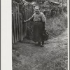 Hungarian miner's wife bringing home coal for the stove from slate pile. Coal camp, Chaplin, West Virginia