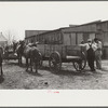 Farmers talking in mule and wagon yard after coming to town on Saturday. Enterprise, Coffee County, Alabama