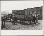 Farmers talking in mule and wagon yard after coming to town on Saturday. Enterprise, Coffee County, Alabama