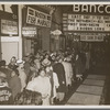 Crowd outside the Banco Theatre in Bedford-Stuyvesant, Brooklyn, for screening of Oscar Micheaux's film The Betrayal, ca. 1948